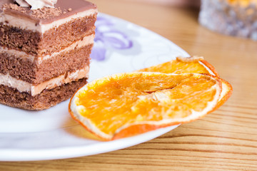 Chocolate cake with strawberry on wooden table close-up