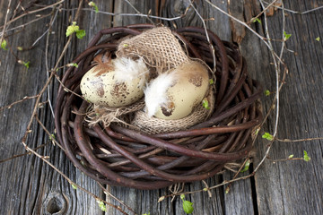 Easter still life with colorfull eggs  in  wicker  basket
