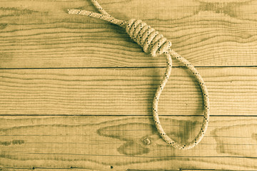 slipknot on wooden background