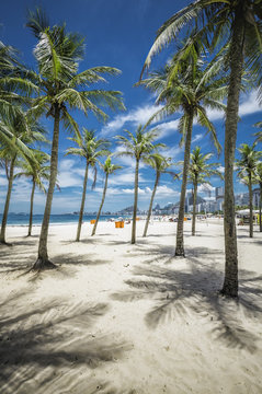 Copacabana Beach with palms and shadows in Rio