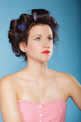 girl with curlers in hair, woman preparing to party.