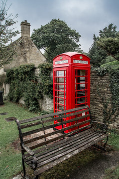 Typical Red English Telephone Booth In Bibury Village