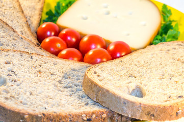 Plate with bread, fresh tomatoes and cheese