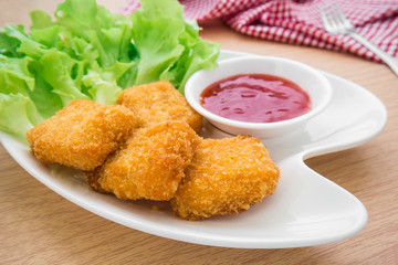 Chicken nuggets with ketchup on plate