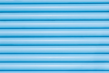 Blue pvc pipes in line for background texture