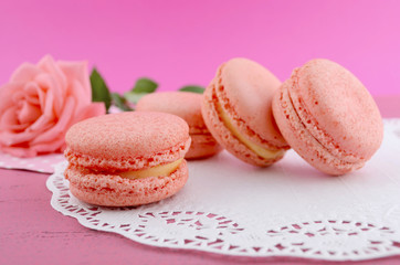 Strawberry flavor macaroons on pink background