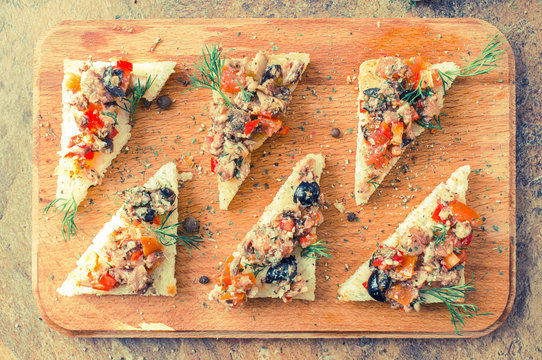 Tapas, pintxos with vegetables and fish