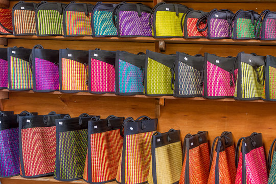 traditional straw bags in souvenir shop