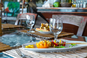 orange and pineapple appetizer served on plate in restaurant or