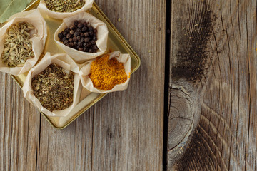 Herbs and spices on wooden table top view