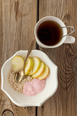 Tea, oatmeal, apples and yoghurt