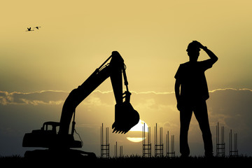 worker construction at sunset