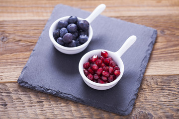 Delicious dessert, flakes flooded in two flavors yogurt with blu