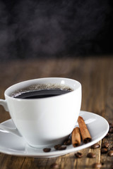 Delicious coffee with sweets on a wooden table