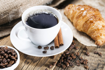 Delicious coffee with sweets on a wooden table