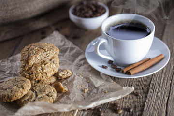 Delicious coffee with sweets on a wooden table