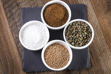 Aromatic spices in white bowls