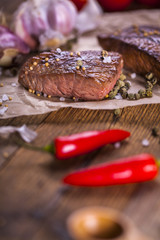 Grilled meat on wooden table