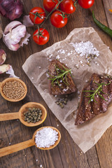Grilled meat on wooden table