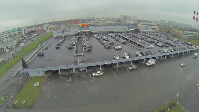 Car traffic on street near shopping center Mall Gallery