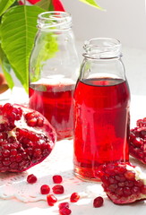 Ripe Red Pomegranates and Fresh Juice