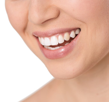 Close-up of beautiful healthy woman's smile with white teeth
