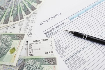 list of polish expenses with a pen