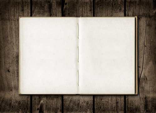 Note book on a dark wood background