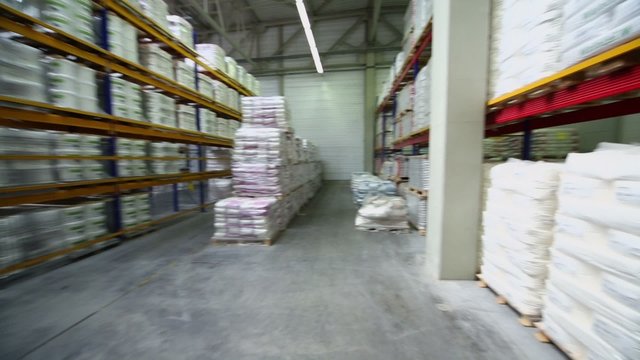 Warehouse with goods on many shelves in Caparol factory