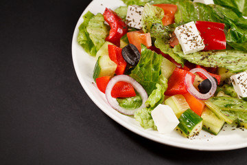 greek vegetable salad with cucumbers, onions herbs cheese