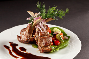 rack of lamb with vegetables and sauce © Maksim Denisenko