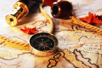 Fototapeta na wymiar Marine still life with world map and spyglass on wooden table background