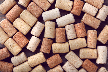 Wine corks on rustic wooden table background