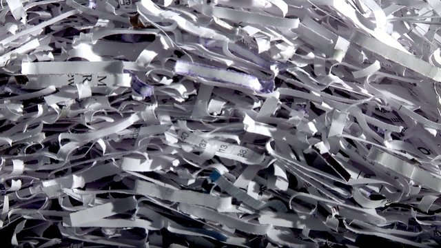 Papers scraps falling from a shredder fill up the screen.  Three clips with transition sped up to create different screen-fill rates.  First transition actually takes one second from black to full screen.  Second is three seconds.  Third is five seconds. 