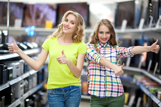 Two girls in the store TV