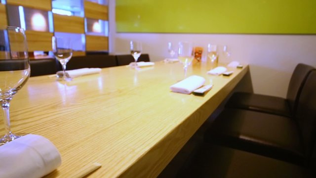 Table appointments with glasses in cafe with modern interior