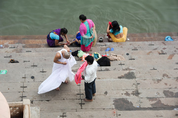 Hindu pilgrims take a holy bath in the river ganges