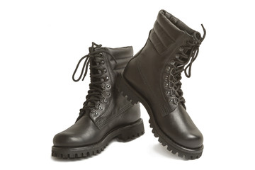 Black leather army boots on a white background