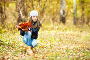 lovely girl  with a bunch of leaves