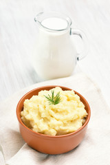 Mashed potato and jug of milk