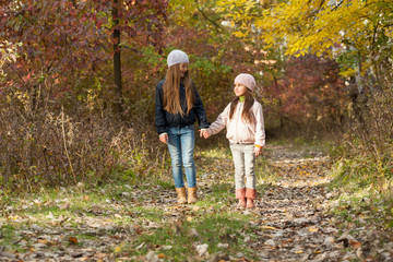 Fototapeta premium two girls walking in the woods