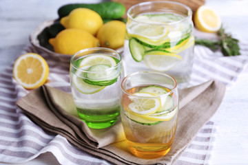 Fresh water with lemon and cucumber in glassware