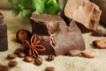 Still life with set of spicy chocolate, nuts and coffee beans