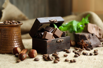 Still life with set of chocolate on burlap cloth, closeup