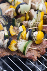 barbecue with delicious grilled meat and vegetables on grill