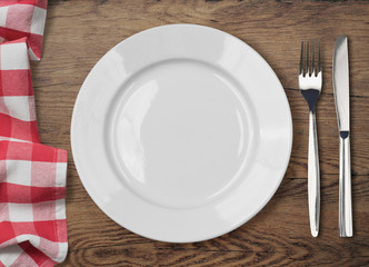 dinner table with dinning plate, fork and knife top view