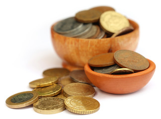 Old coins arranged in bowls