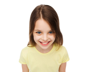 smiling little girl over white background