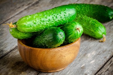 organic cucumbers in a wooden bowl