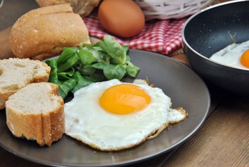 Fototapeta premium Fried eggs with bread and oil